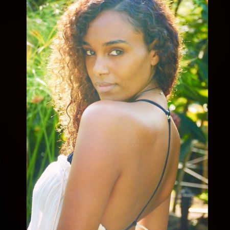 Gelila Bekele in a white dress poses a picture.